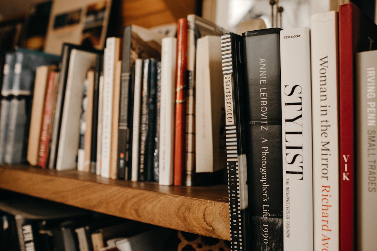 A cozy bookshelf setting showcasing assorted hardcover books emphasizing literature and knowledge.